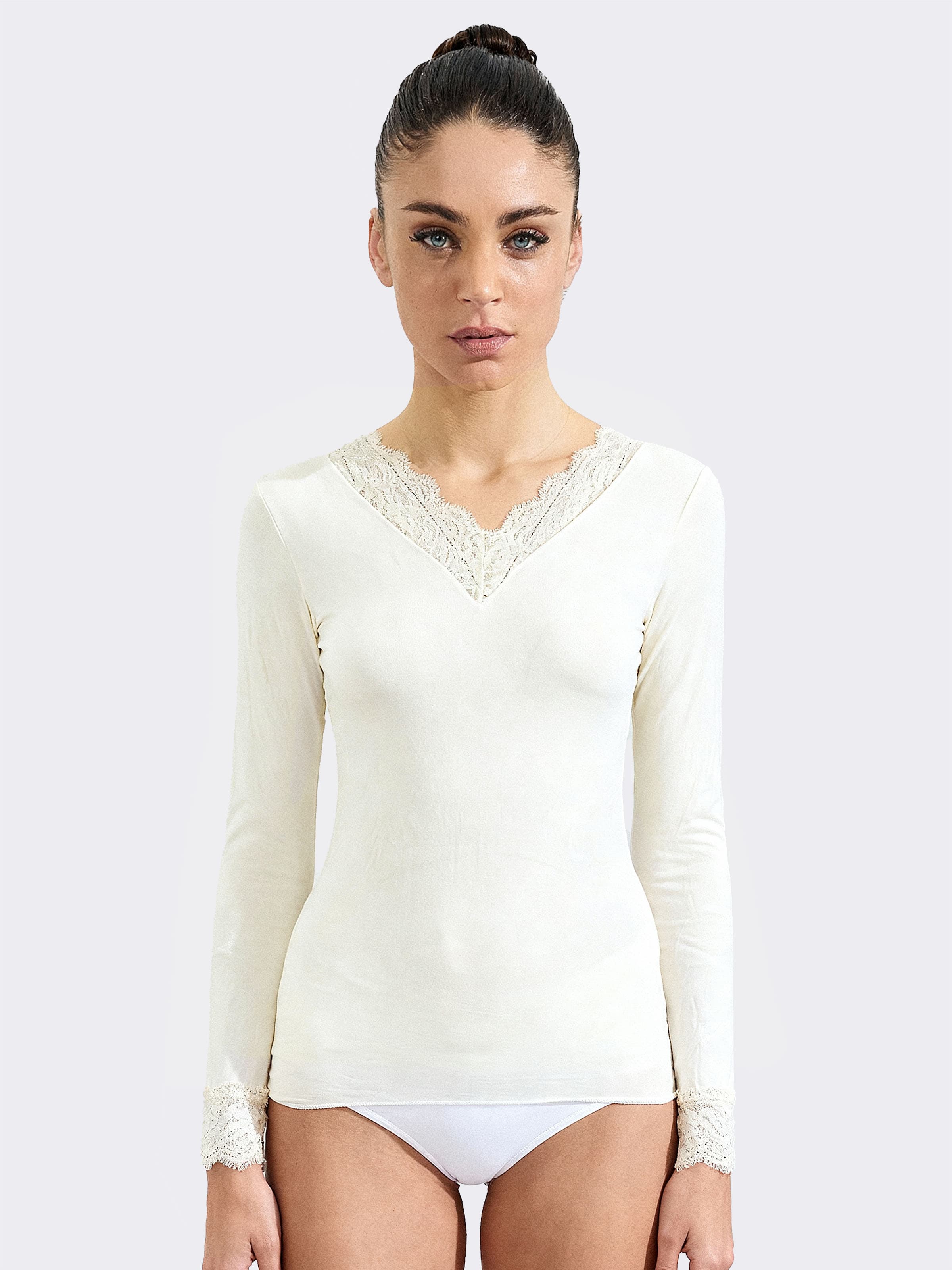 White women's sweater with lace neckline and cuffs